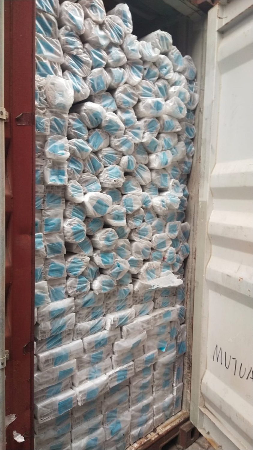 Container packed with shrink-wrapped palletised cargo